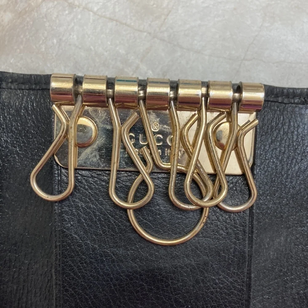 Gucci black signature canvas leather key holder